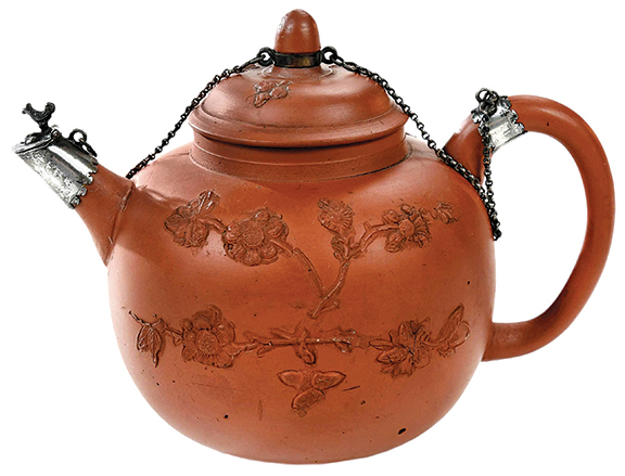Constance and Dudley Godfrey’s exquisite taste was evident in this Elers brothers silver-mounted unglazed redware teapot. The top is decorated with three applied acorn sprigs and the body with applied flowering prunus branches. The 5" x 6¾" pot, made in Staffordshire circa 1695, sold to a phone bidder for $19,680 (est. $10,000/12,000).