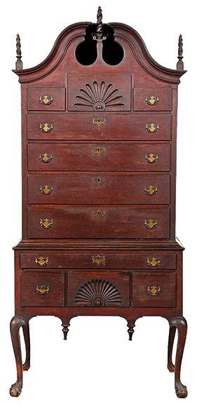 Joel and Ann Finn acquired this Chippendale bonnet-top high chest in the 1980s from Avis Hicock. She lived on Main Street in Woodbury, Connecticut, in the home that was originally owned by her great-grandfather David J. Stiles. The 94" x 43" x 22" two-section chest sold to the phones for $46,740 (est. $40,000/60,000).
