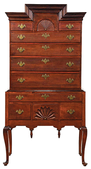 This 80" x 41½" x 21" Queen Anne highboy is attributed to Woodbury, Connecticut, cabinetmakers, 1760-80. It had descended in the Sherman family of Woodbury and is notable for its stepped cornice, a regional characteristic. The chest sold to the phones for $10,455 (est. $12,000/18,000).