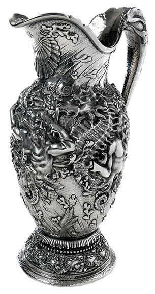 The top silver lot was this Tiffany sterling pitcher with Triton, Poseidon, and giant sea horses on the body and a sea creature for a handle. The 13½" tall pitcher sold on the Invaluable bidding platform for $28,160 (est. $10,000/15,000).